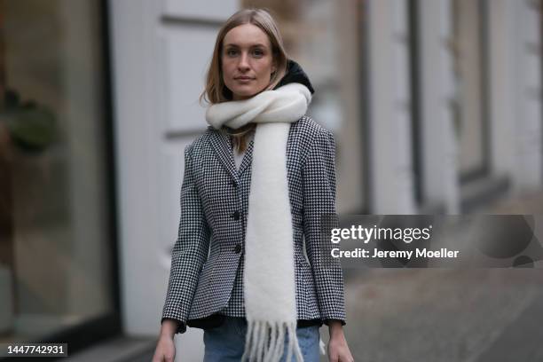 Model and Content Creator Marlies Pia Pfeifhofer wearing Dior black/white checked blazer jacket, Dior black hooded gilet, Agolde Criss Cross blue...
