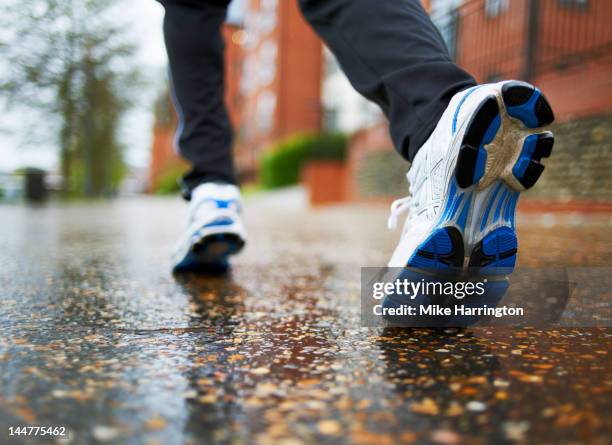 male running in residential area - laufschuhe stock-fotos und bilder