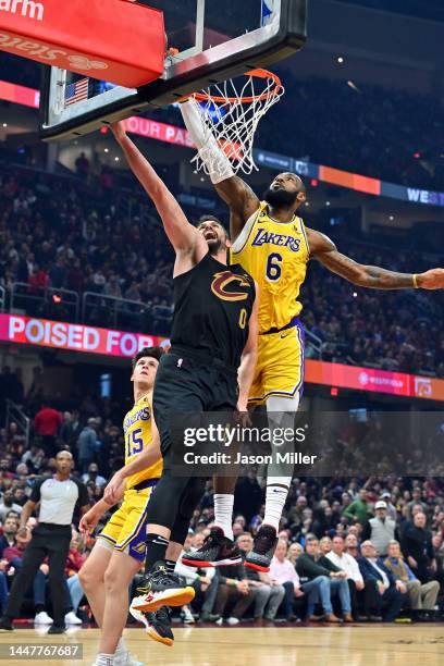 Kevin Love of the Cleveland Cavaliers shoots over LeBron James of the Los Angeles Lakers during the first quarter at Rocket Mortgage Fieldhouse on...