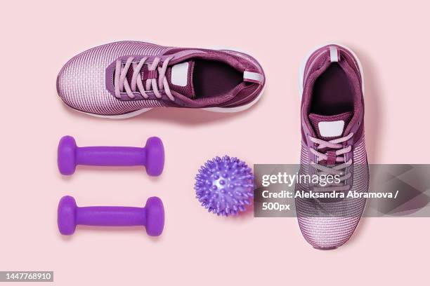 directly above shot of shoes and shoes on pink background,netherlands - massagebal stockfoto's en -beelden