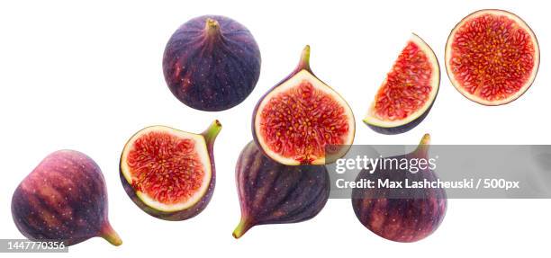close-up of figs against white background - fig stock pictures, royalty-free photos & images