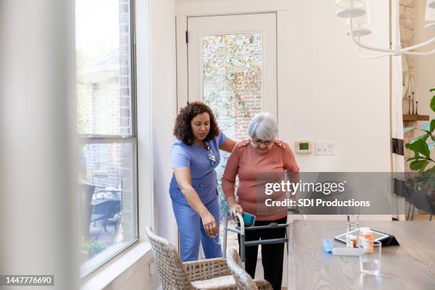 physical therapist works with her patient - showing compassion stock pictures, royalty-free photos & images