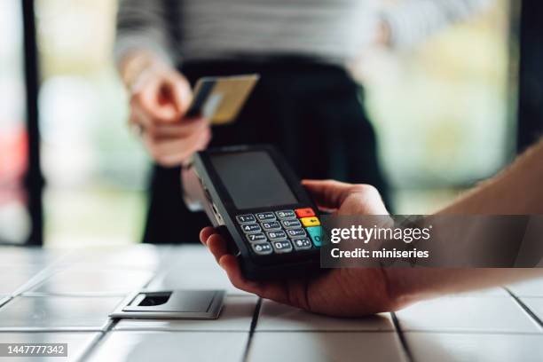 anonymous person making a card transaction - card payment bildbanksfoton och bilder