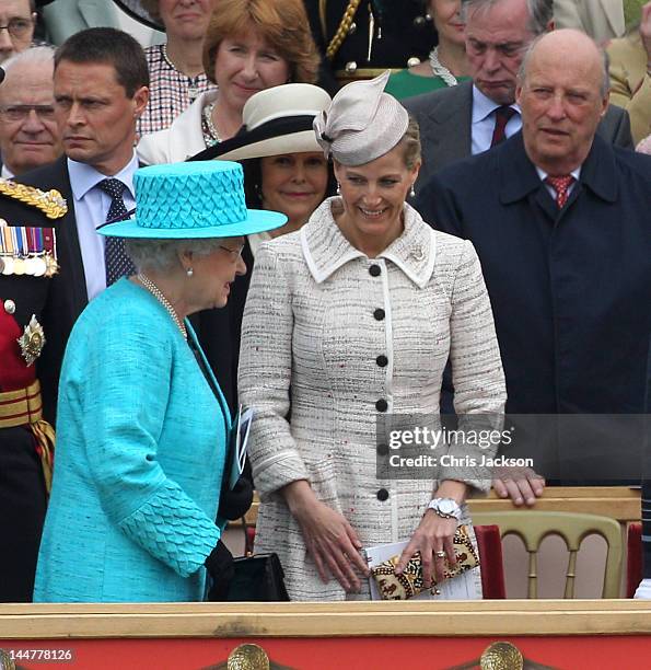 Queen Elizabeth II smiles as she walks past Sophie, Countess of Wessex and the King Harald V of Norway and Queen Sonja of Norway during the Armed...