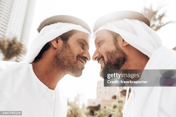 gay arab man together face to face - arab couple stock pictures, royalty-free photos & images