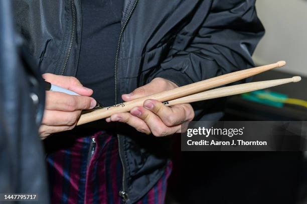 Mau y Ricky sign drum sticks for a student during Latin GRAMMY In The Schools Detroit sponsored by Ford Motor Company Fund at Academy of the Americas...