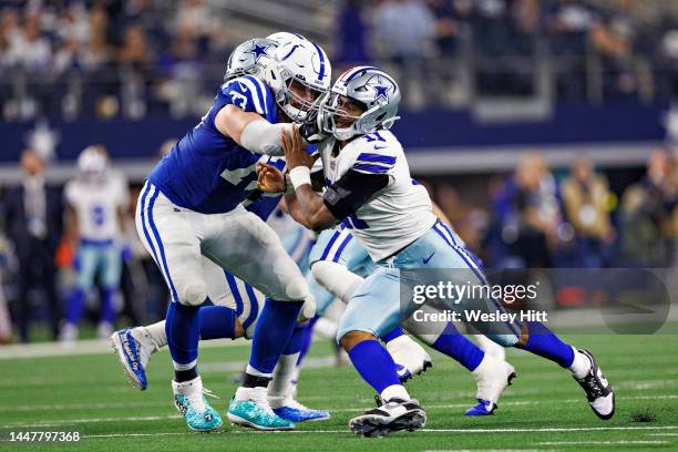 Micah Parsons of the Dallas Cowboys rushes the quarterback and is blocked by Dennis Kelly of the Indianapolis Colts at AT&T Stadium on December 4,...