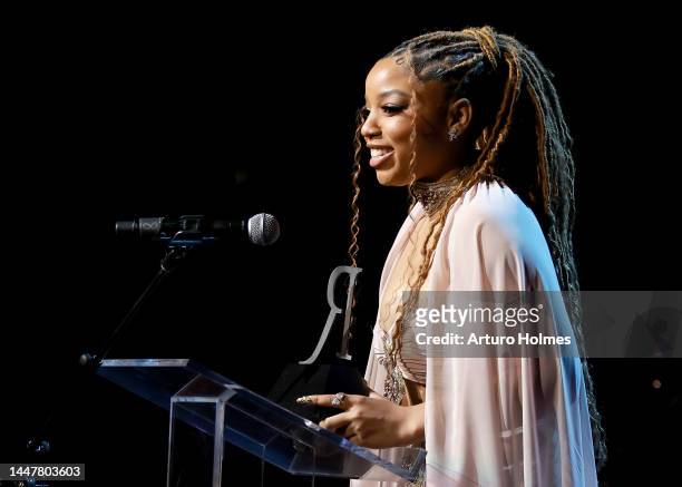 Chloe Bailey accepts an award onstage during the 13th Annual Root 100 Gala at The Apollo Theater on December 08, 2022 in New York City.