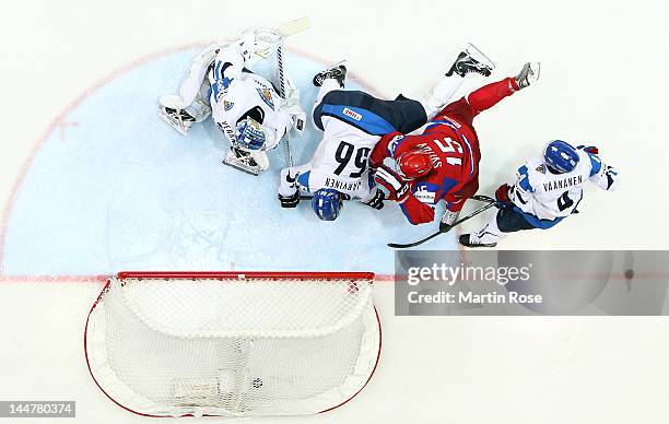 Alexander Svitov of Russia scores over Petri Vehanen , goaltender of Finland during the IIHF World Championship semi final match between Russia and...