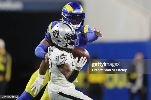 Davante Adams of the Las Vegas Raiders makes a reception against Jalen Ramsey of the Los Angeles Rams during the first quarter at SoFi Stadium on...