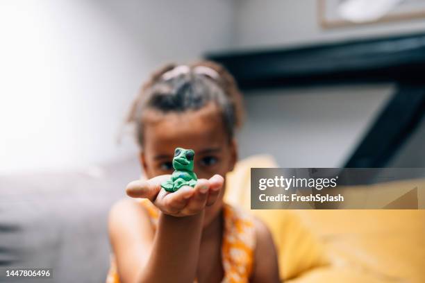 a cute girl playing at home with plasticine - clay stock pictures, royalty-free photos & images