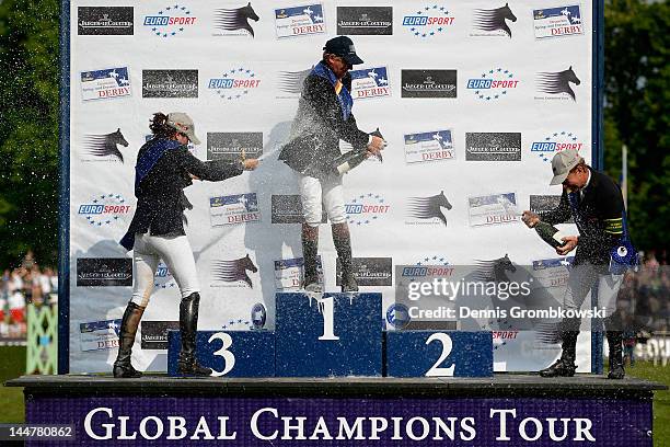 Katrin Eckermann of Germany, Nick Skelton of Great Britain and Rolf-Goeran Bengtsson of Sweden celebrate at the podium after the CSI5 Global...