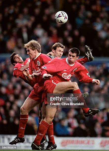 Karl Heinz Riedle, Steve Staunton and Jamie Carragher of Liverpool rise to deny the ball to Duncan Ferguson of Newcastle United on 28th December 1998...