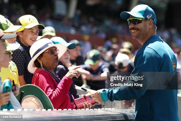 David Warner of Australia signs autographs for fans before day two of the Second Test Match in the series between Australia and the West Indies at...