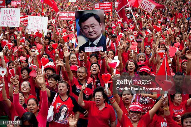 Tens of thousands of red shirts cheer during a rally to commemorate the second anniversary of the violent government crackdown May 19, 2012 in...