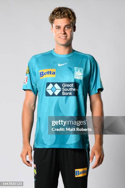 Spencer Johnson poses during the Brisbane Heat Big Bash League headshots session at Metricon Stadium on December 09, 2022 in Brisbane, Australia.