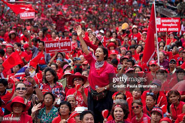 Red shirts cheer during a rally as tens of thousands gathered to commemorate the second anniversary of the violent government crackdown May 19, 2012...