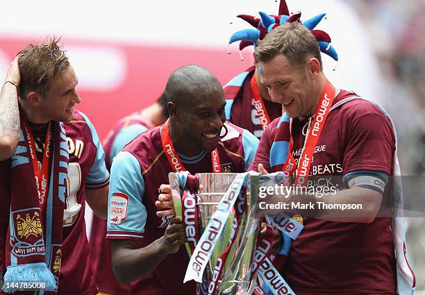 West Ham captain Kevin Nolan and goalscorer Carlton Cole and Matt Taylor with the Championship trophy during the npower Championship - Playoff Final...