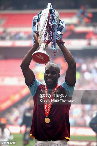 Carlton Cole of West Ham celebrates victory with the Championship trophy during the npower Championship - Playoff Final between West Ham United and...