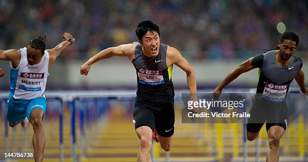 Liu Xiang of China celebrates after winning the Men's 110m Hurdles against Aries Merritt of the USA and Jason Richardson of the USA on May 19, 2012...