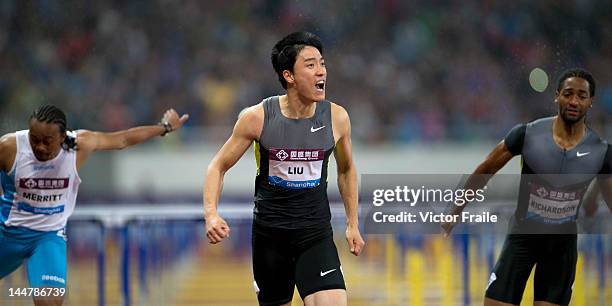 Liu Xiang of China celebrates after winning the Men's 110m Hurdles against Aries Merritt of the USA and Jason Richardson of the USA on May 19, 2012...