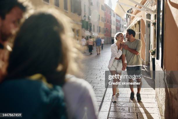 young happy couple enjoying in walk on the street. - croatia tourist stock pictures, royalty-free photos & images