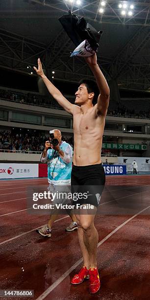 Liu Xiang of China celebrates after winning the Men 110m Hurdles on May 19, 2012 at the Shanghai Stadium in Shanghai, China.