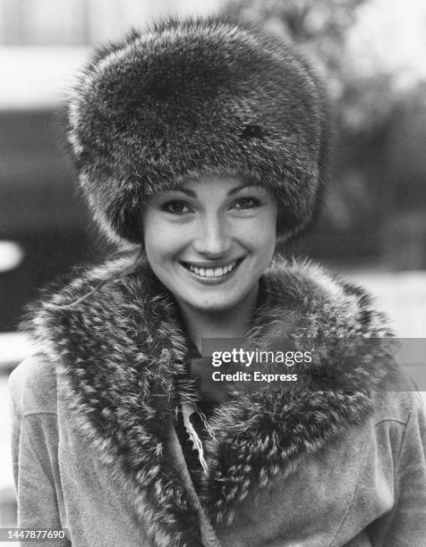 British actress Jane Seymour, wearing a fur hat and a fur-trimmed suede coat, during a photocall for the new James Bond film, 'Live and Let Die,' in...