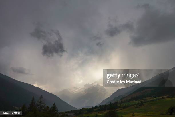 hill landscape and mystical sunset/sunrise behind the cloud - 4k resolution stock pictures, royalty-free photos & images