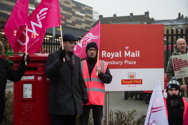 GBR: CWU Striking Postal Workers March To Parliament Square
