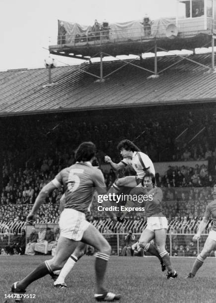 British footballer Kevin Keegan, of England, leaps above Northern Irish footballer David McCreery during the 1980 European Championships Group One...