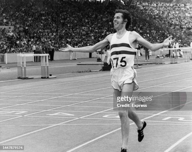 British long-distance runner Brendan Foster arms outstretched in celebration after winning the 5000 Meters at the European Cup athletics meeting,...