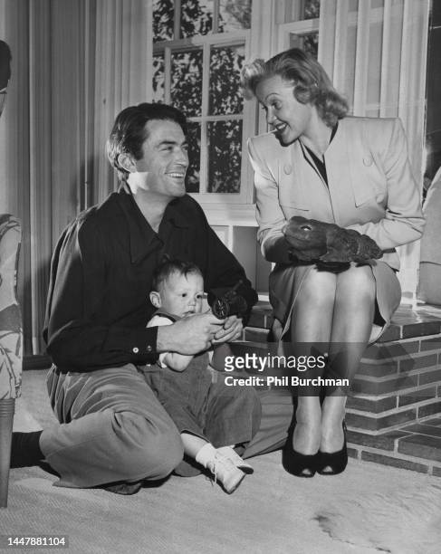 American actor Gregory Peck with his Finnish wife, Greta Peck and their son, Jonathan Peck at home, United States, 1945.