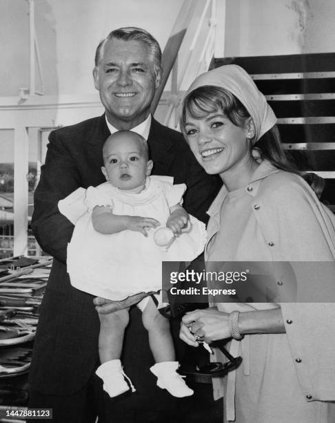 British-born American actor Cary Grant with his wife, American actress Dyan Cannon, and their baby daughter, Jennifer, aboard the P&O liner SS...