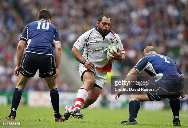 John Afoa of Ulster tries to break down the Leinster defence during the Heineken Cup Final between Leinster and Ulster at Twickenham Stadium on May...