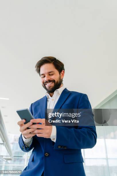 portrait of caucasian businessman using smartphone on white background. - transportation building type of building stock pictures, royalty-free photos & images