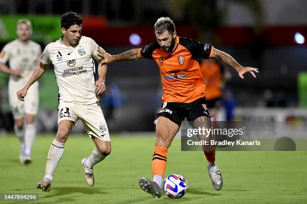 Charles Austin of the Roar is challenged by Javier Lopez Rodriguez of Adelaideduring the A-League Men's match between the Brisbane Roar and Adelaide...