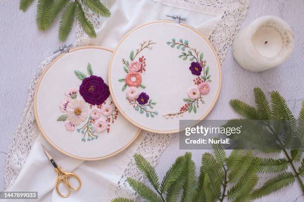 overhead view of two embroidery hoops with floral decoration - embroidery-frame stock pictures, royalty-free photos & images