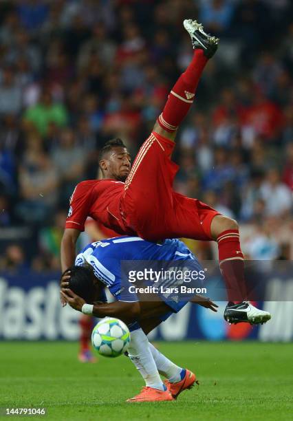 Jerome Boateng of FC Bayern Muenchen falls over Didier Drogba of Chelsea during UEFA Champions League Final between FC Bayern Muenchen and Chelsea at...