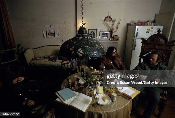 American author & screenwriter Terry Southern and actor Rip Torn talk together in Torn's Chelsea apartment, New York, New York, February 1973.