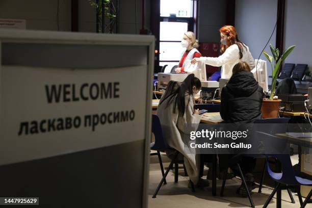 Newly-arrived refugees from Ukraine undergo registration at a refugees welcome center at former Tegel airport on December 09, 2022 in Berlin,...