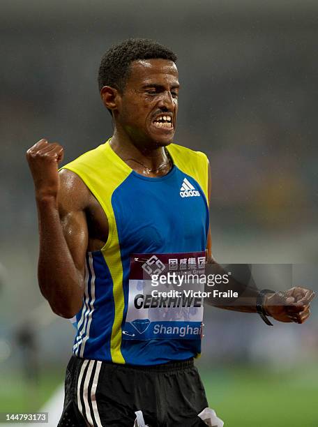 Hagos Gebrehiwot of Ethiopia celebrates after winning the Men's 5000m during the Samsung Diamond League on May 19, 2012 at the Shanghai Stadium in...