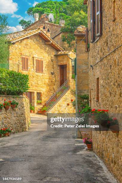 street in the tuscan village of monticchiello - stone house stock pictures, royalty-free photos & images