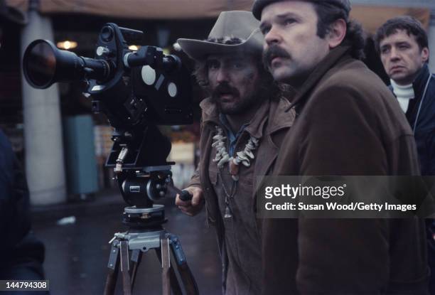 American actor and director Dennis Hopper looks through the camera lens during the filming of his directorial debut 'Easy Rider,' New Orleans,...
