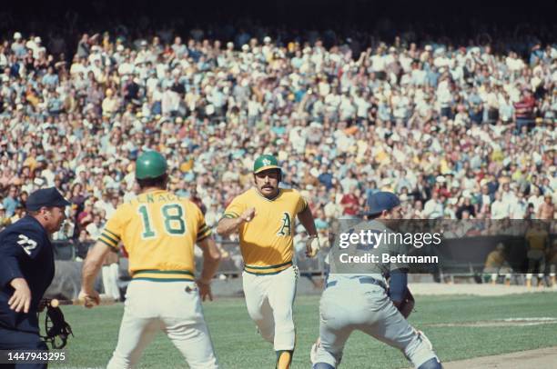 American baseball player Gene Tenace, American baseball player Sal Bando, and American baseball player Jerry Grote in action during an 1973 World...