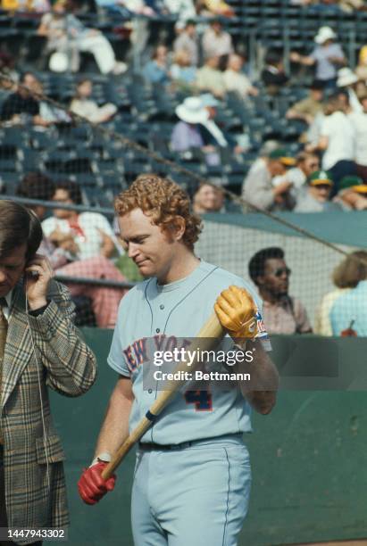 American baseball player Rusty Staub , without his helmet, holding his bat, during an 1973 World Series match between the Oakland Athletics and the...