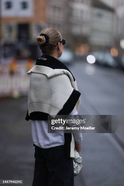 Model und Content Creator Marlies Pia Pfeifhofer wearing Allude white turtleneck sweater, Axel Arigato black/white knit pullover, Zara black denim...