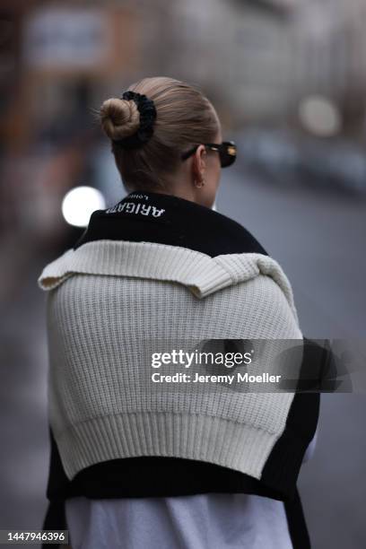 Model und Content Creator Marlies Pia Pfeifhofer wearing Allude white turtleneck sweater, Axel Arigato black/white knit pullover, Alina Abegg gold...