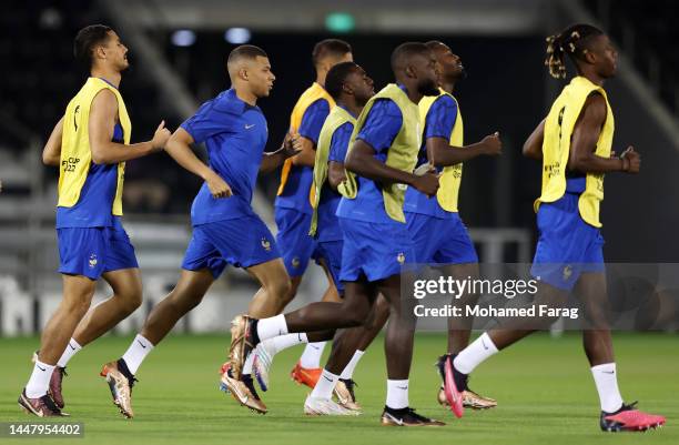 Kylian Mbappe of France trains with teammates during the France Training Session Training Session at Al Saad SC on December 09, 2022 in Doha, Qatar.