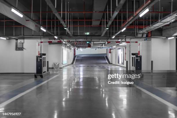 entrance and exit of underground parking lot - parking entrance fotografías e imágenes de stock